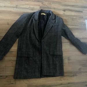 Women’s blazer brand new never worn, wool material lined with satin. Size large